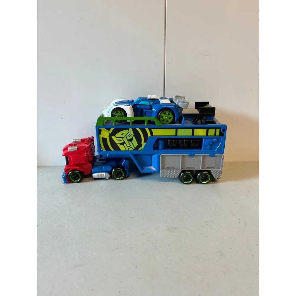 Transformers Robots in Disguise Optimus Prime Racing Trailer Truck and Car Set